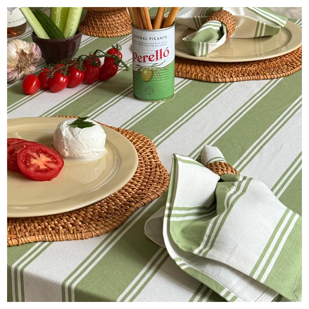 Murano-Stripe-Napkin-on-Tablecloth-in-Oliva-Verde_0dd690b8-ec3d-4e1f-8d9a-8b04cd4800f5.jpg?output=png&maxage=31d&w=1048&h=1048&fit=contain&we&n=-1