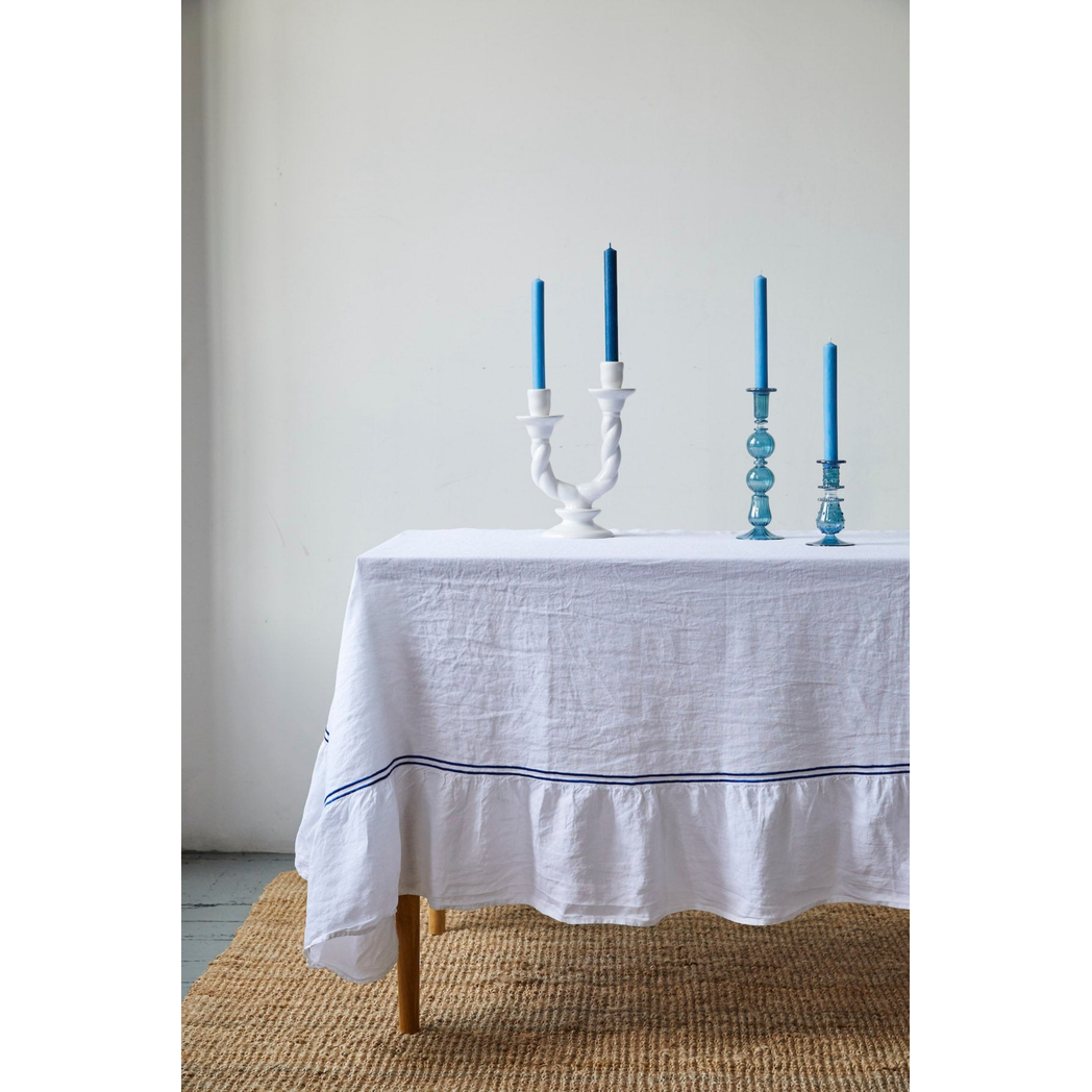 IssyGranger-WhiteDoublePipedLinenTableclothwithcandlesticks.jpg?output=png&maxage=31d&w=1048&h=1048&fit=contain&we&n=-1