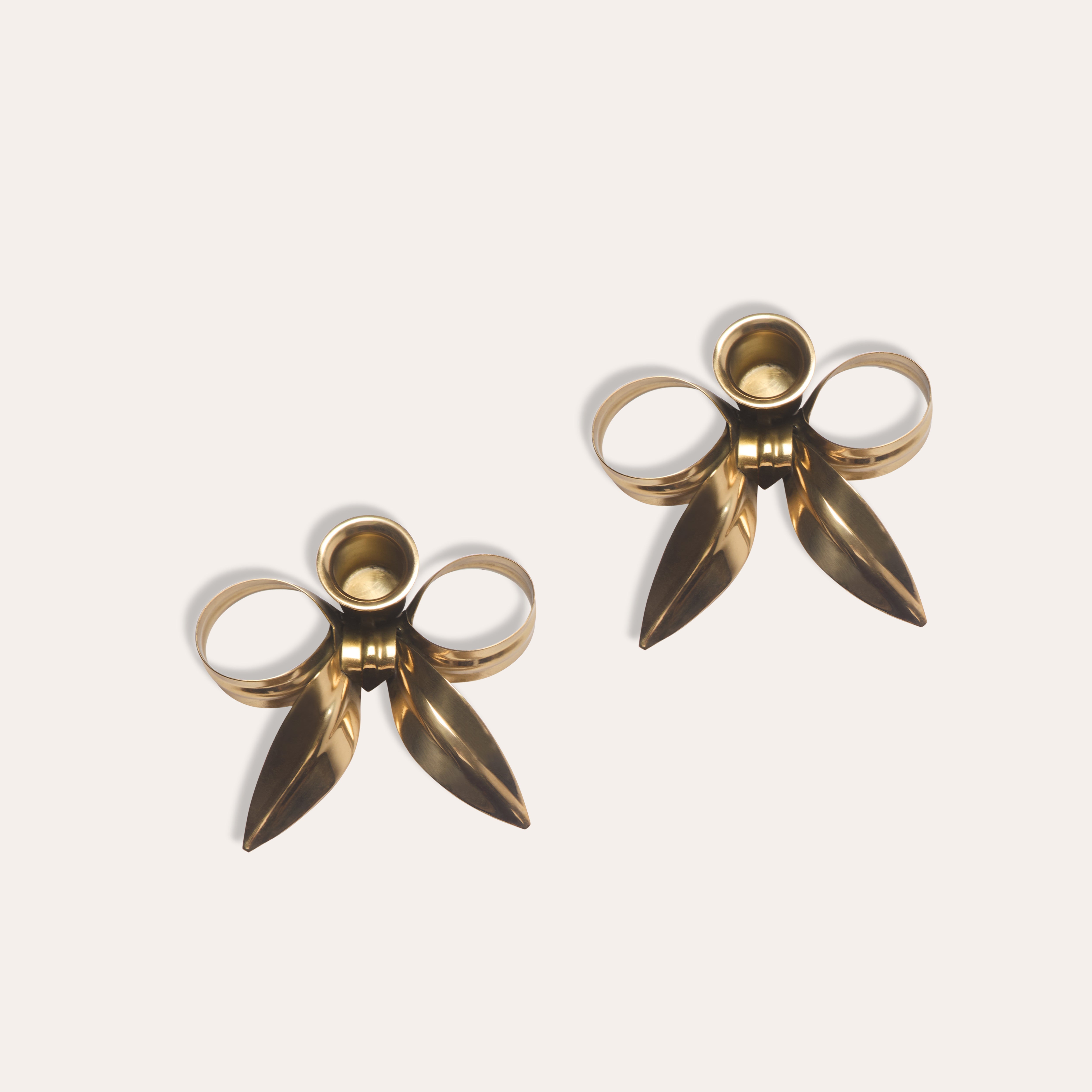A Pair of Bow Candleholders | Brass