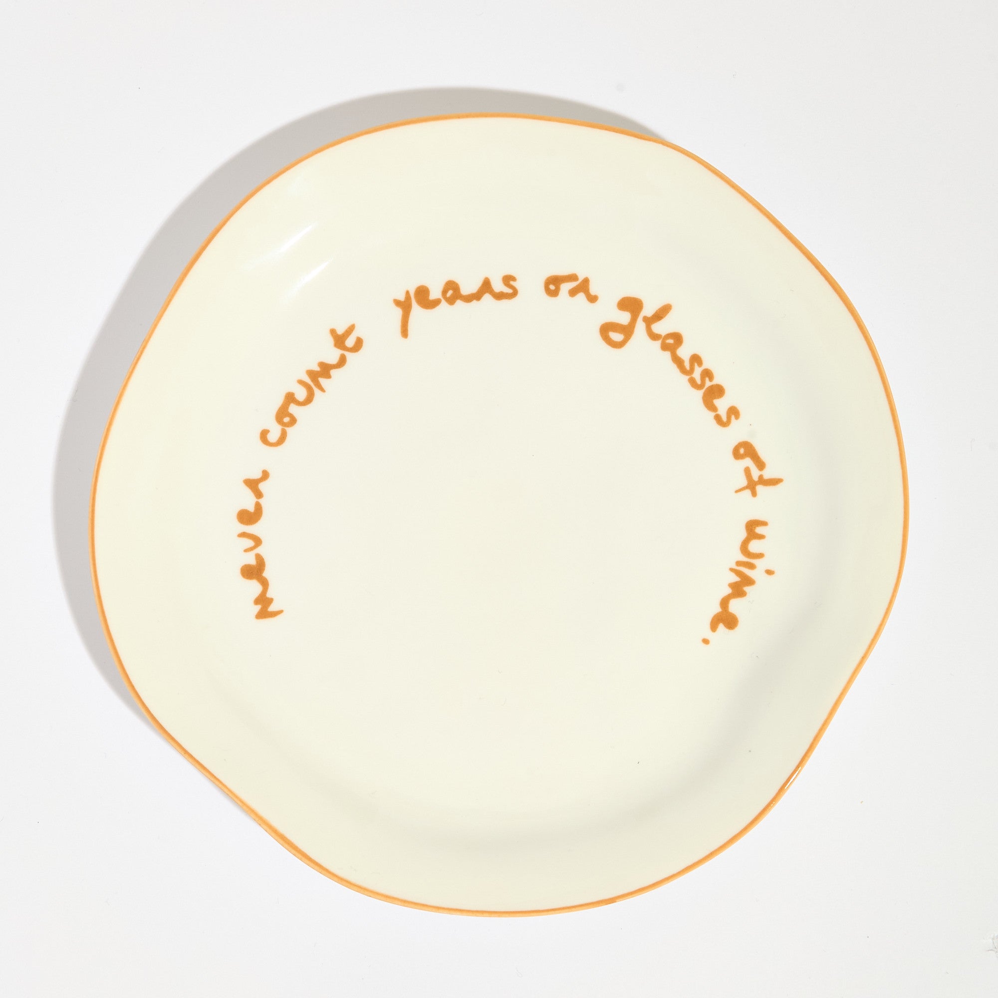 Statement plate - "Never Count Years and Glasses of Wine"