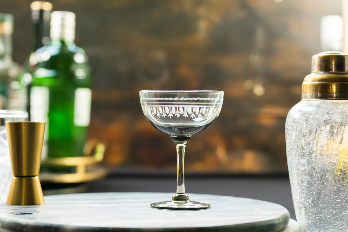 four smoky crystal champagne saucers with ovals design