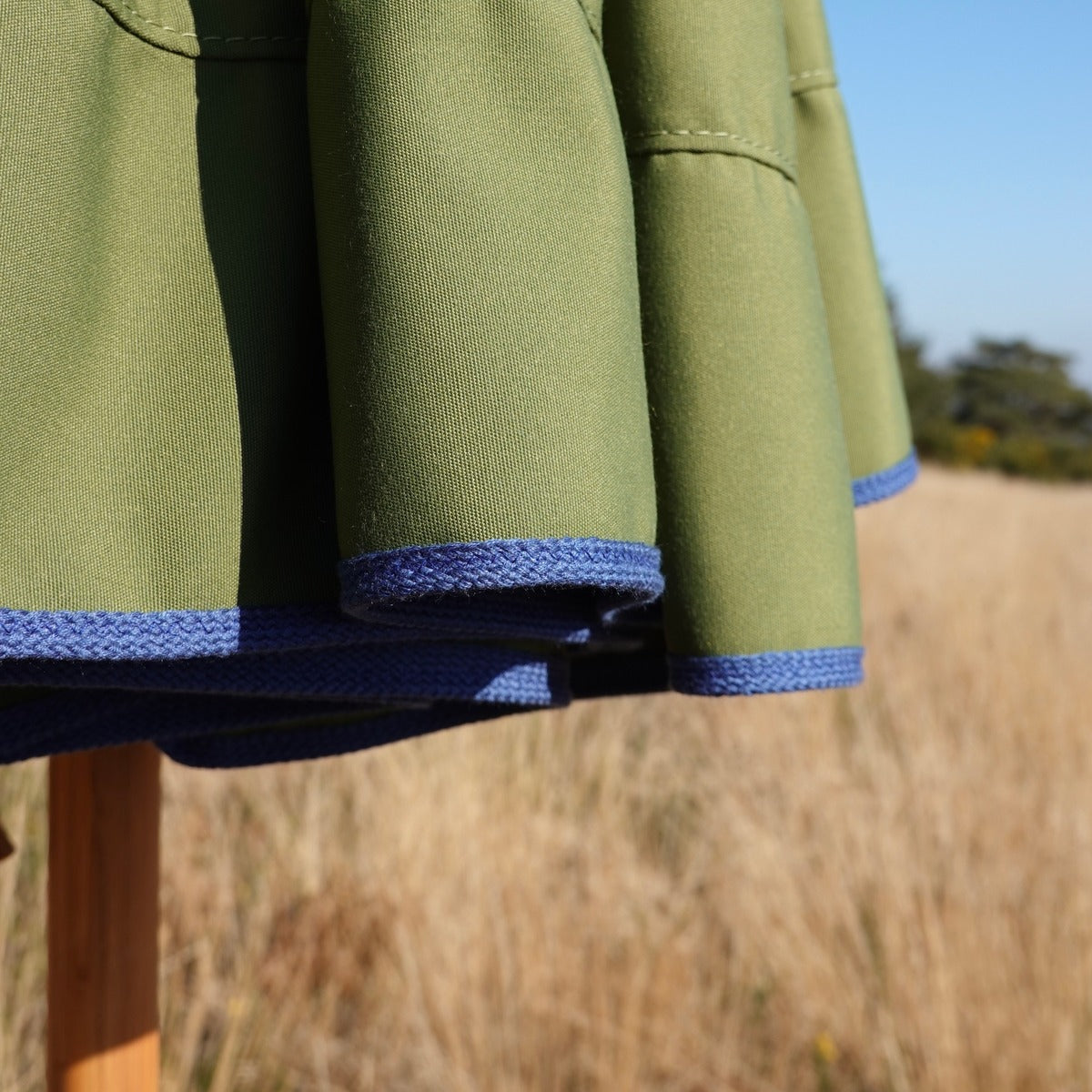 Parasol with contrast colour trim valance
