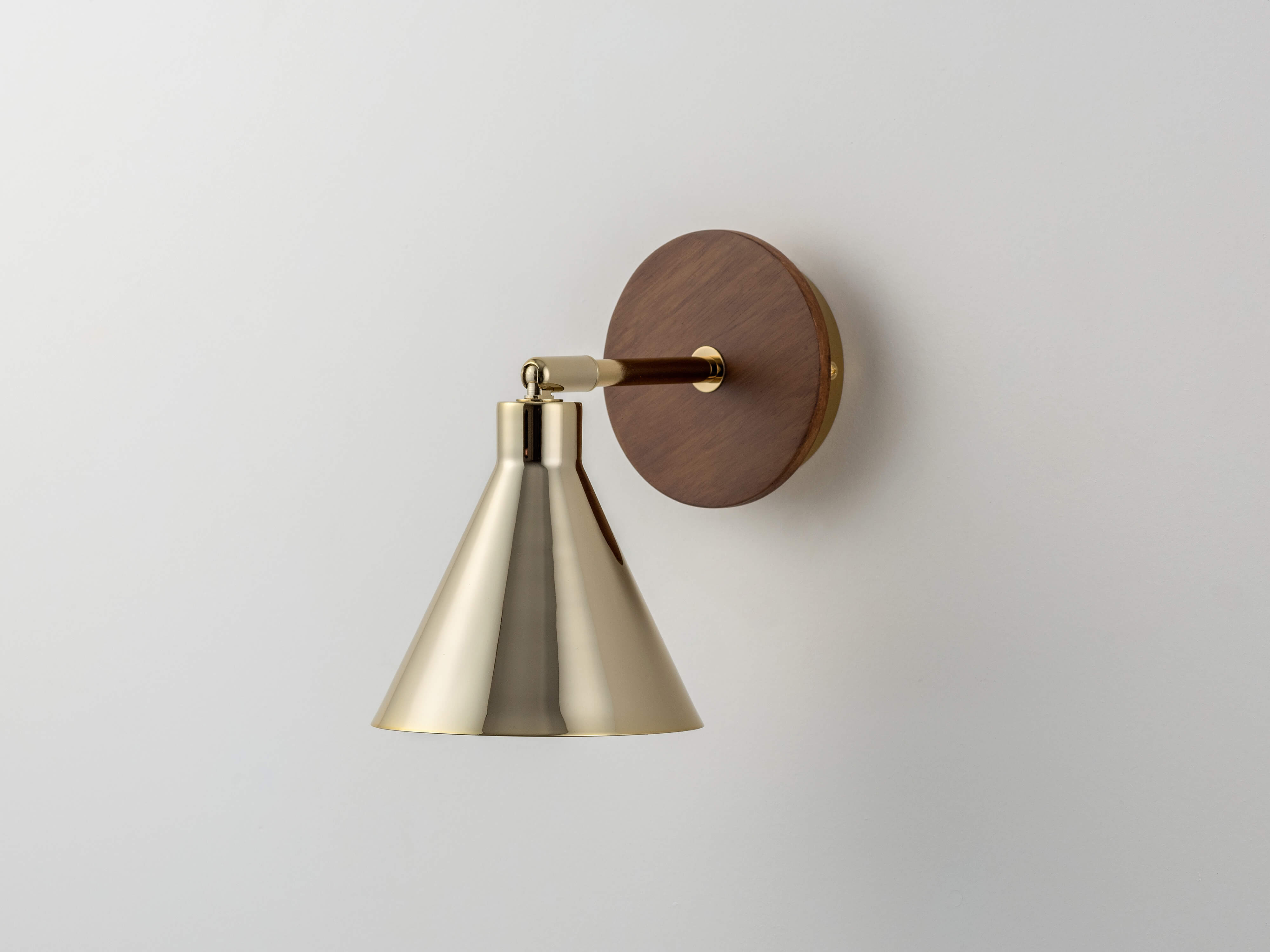 Brass cone wall light