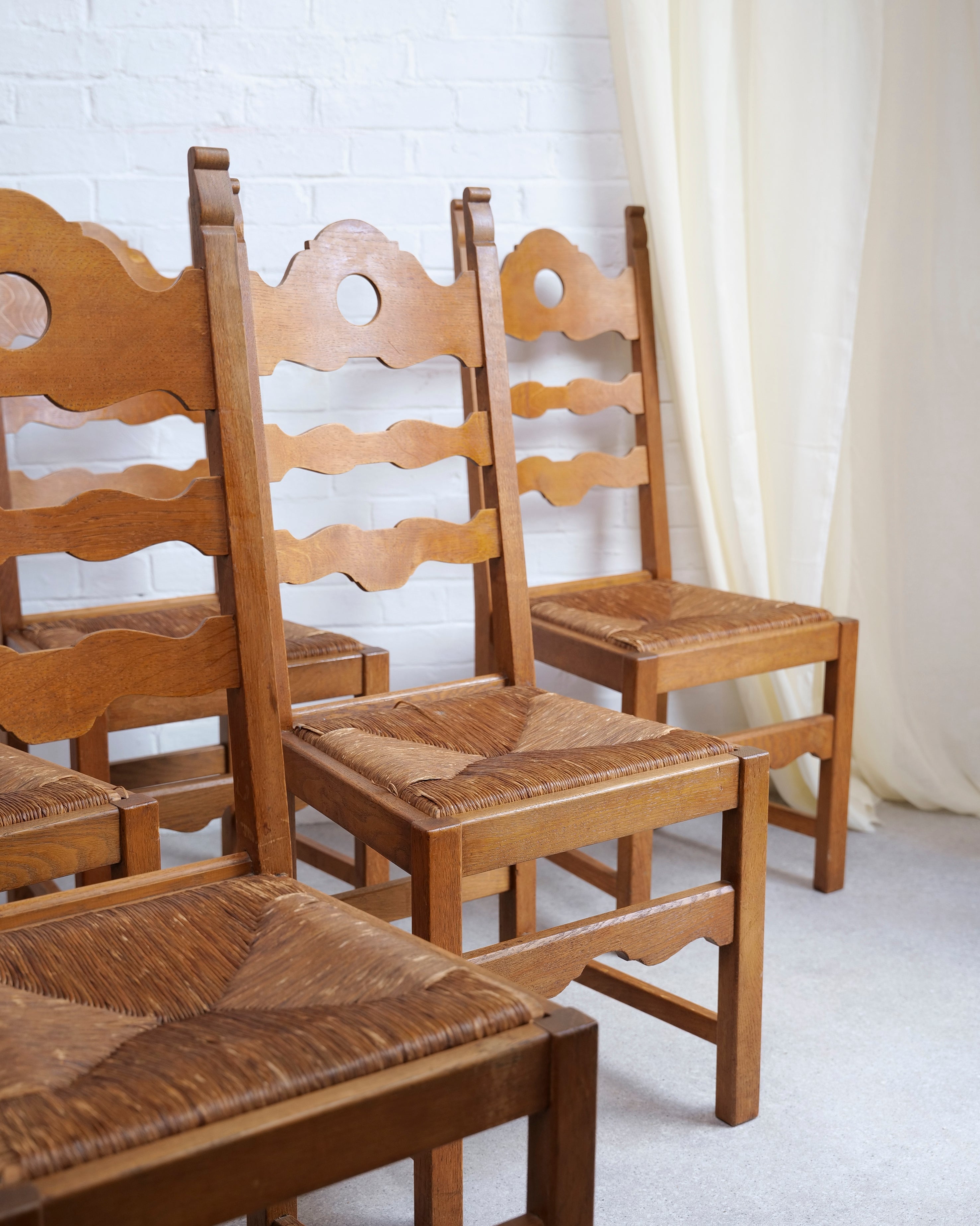 A Set of 6 Razor Back Chairs