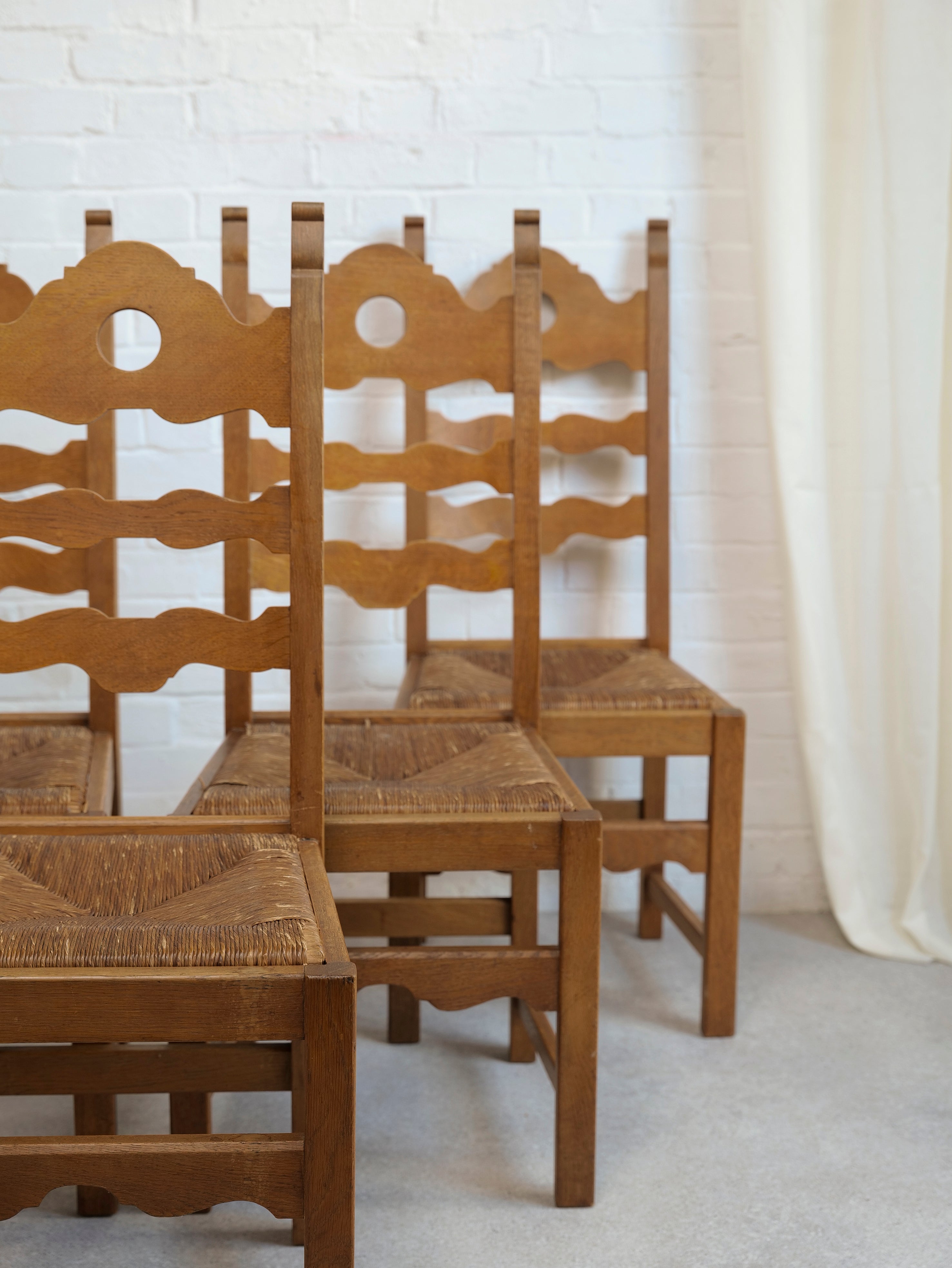 A Set of 6 Razor Back Chairs