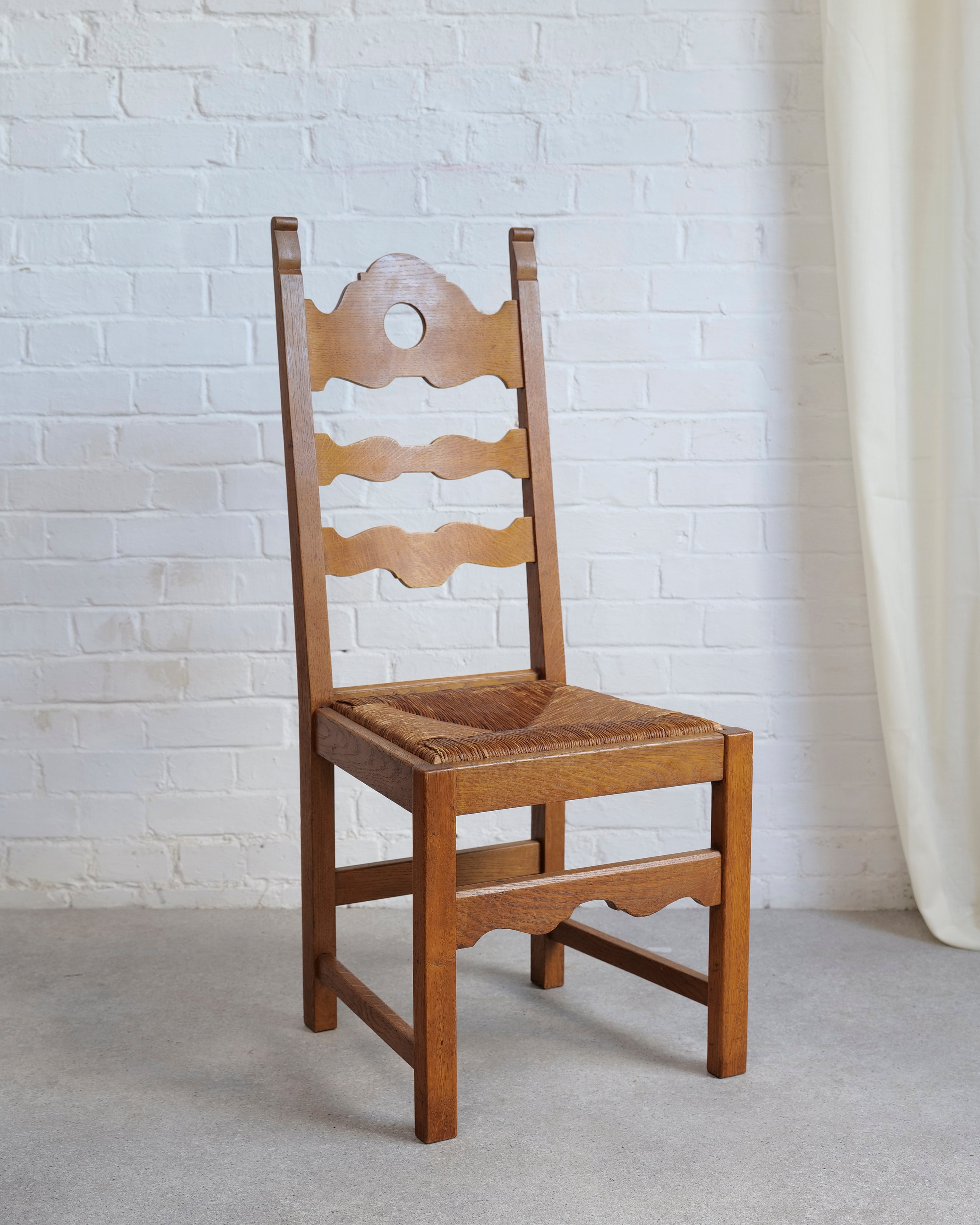 A Set of 6 Razor Back Chairs