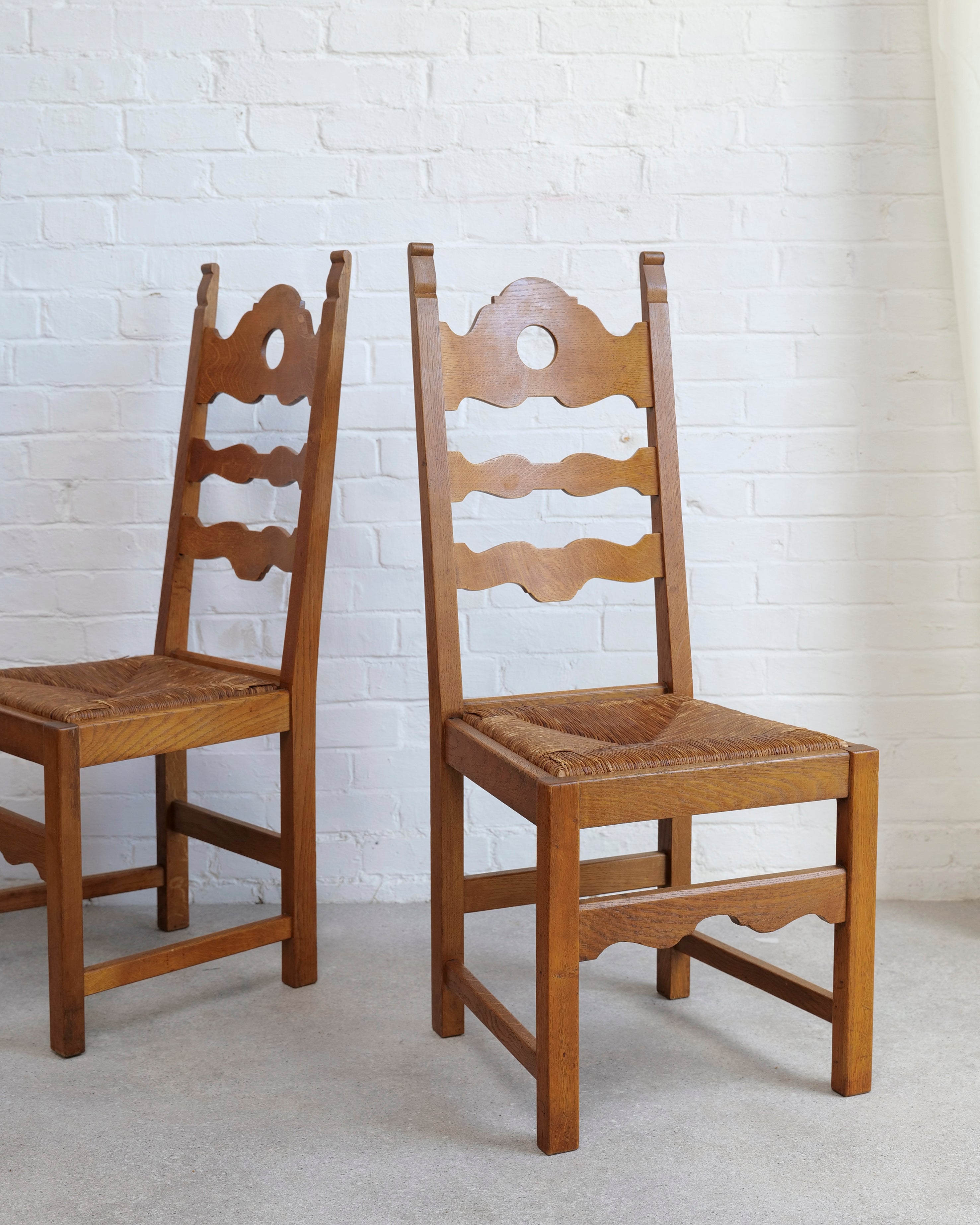 A Set of 6 Razor Back Chairs