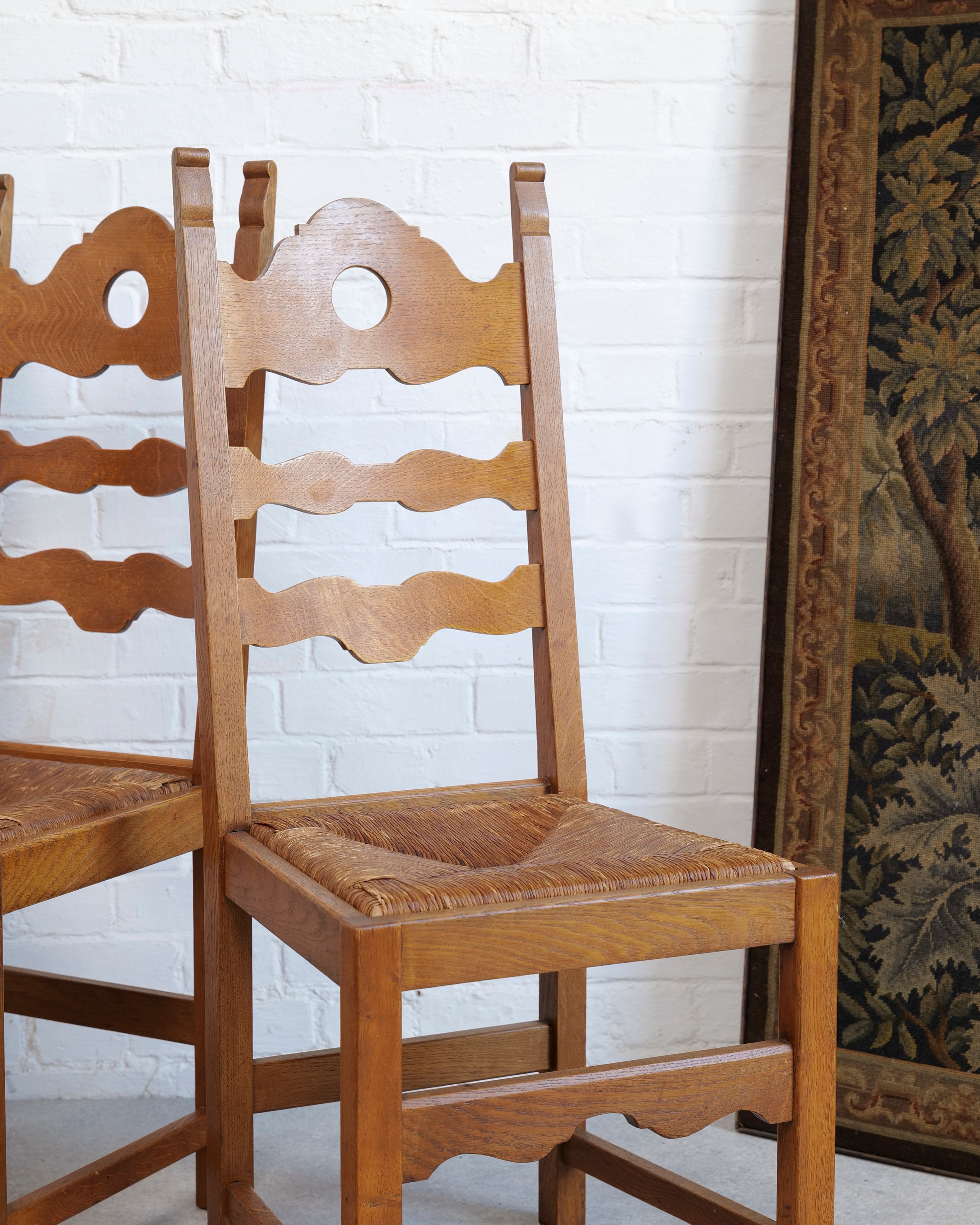 A Set of 6 Razor Back Chairs