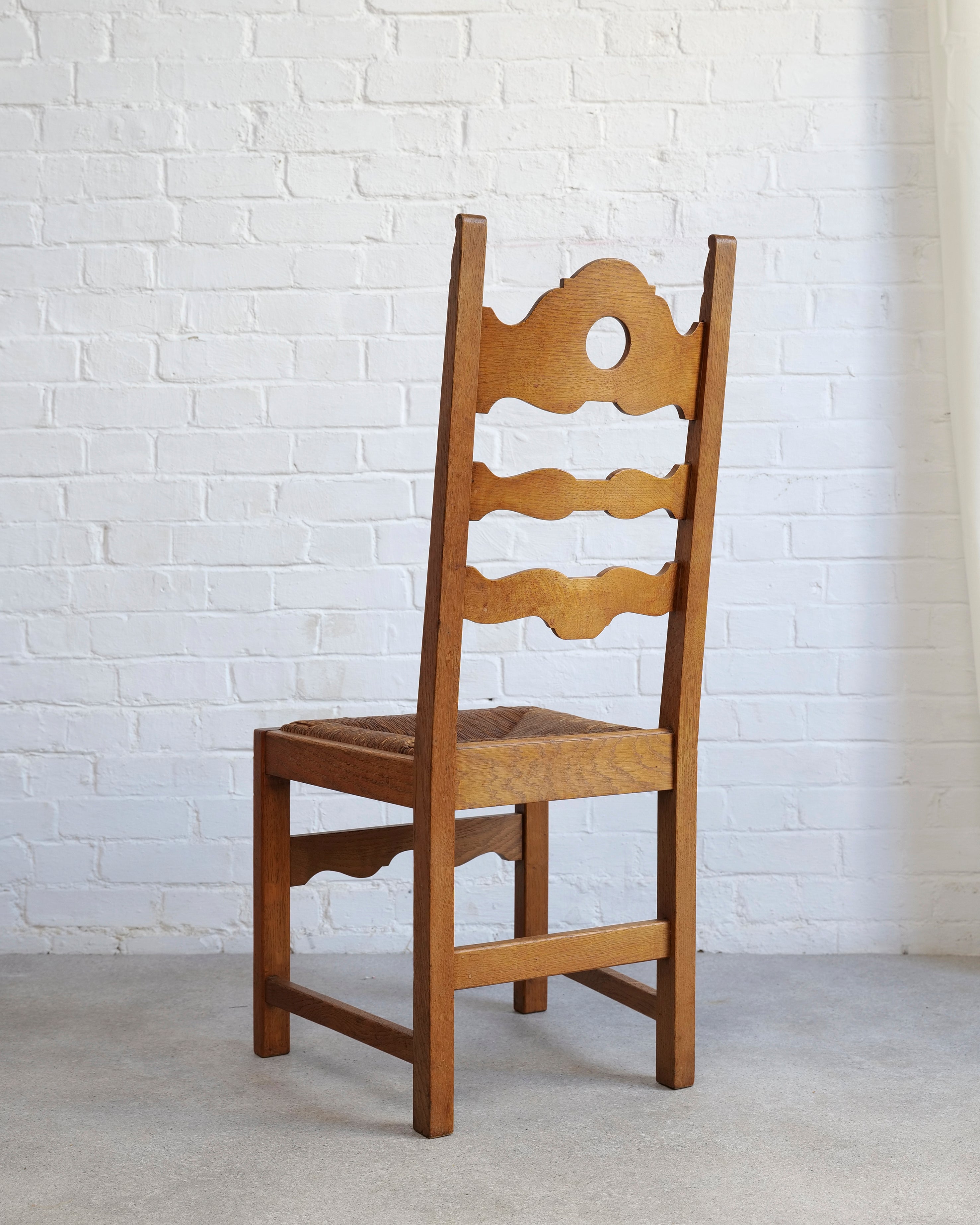 A Set of 6 Razor Back Chairs