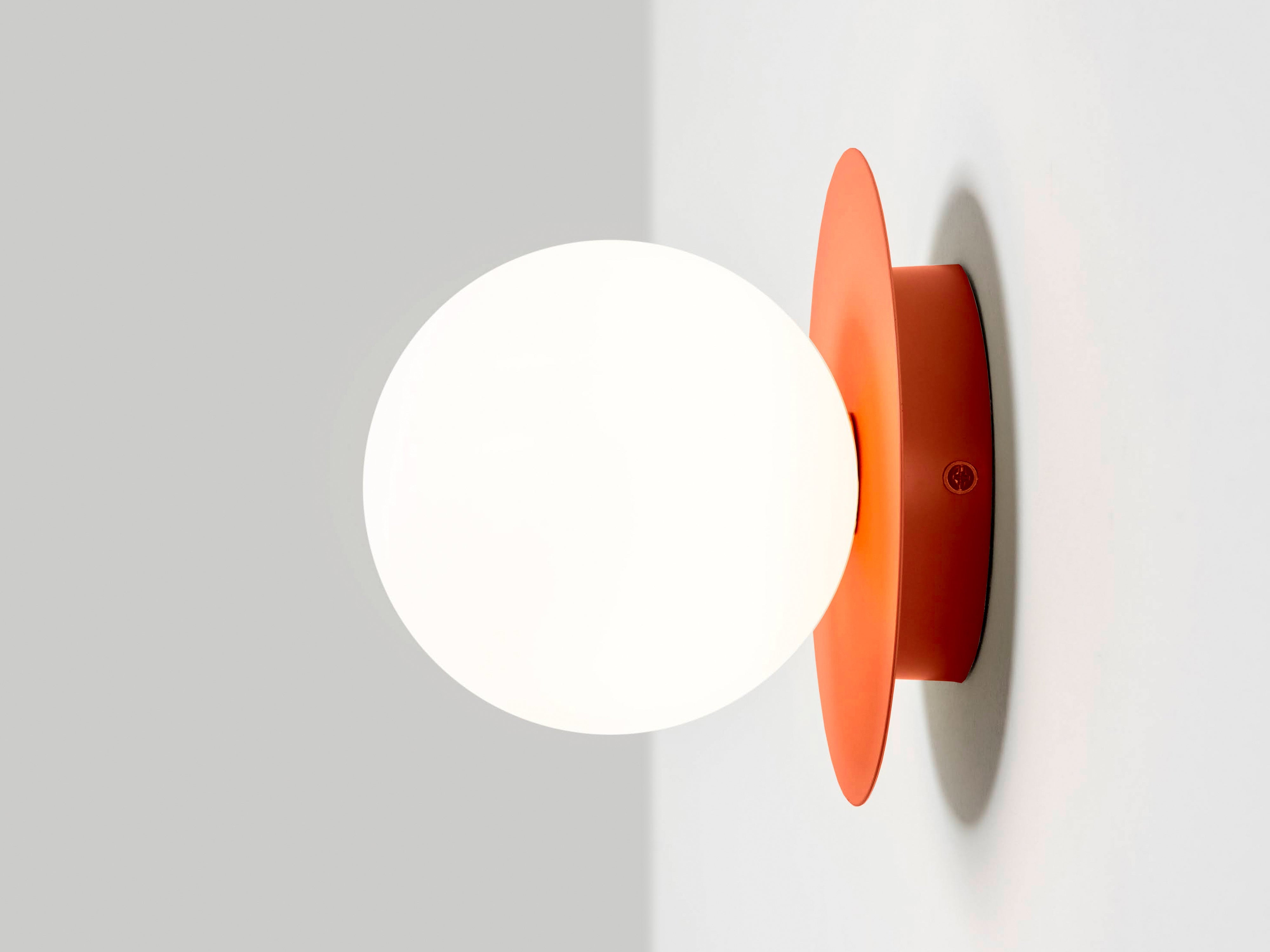 Peel orange opal disk wall light