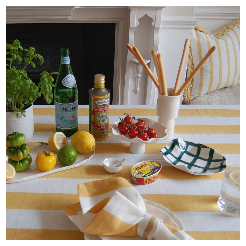 STRIPED-YELLOW-TABLE-SETTING-LINEN-TABLE-CLOTH-AND-NAPKINS-EVIE-_-SKYE.jpg?output=png&maxage=31d&w=1048&h=1048&fit=contain&we&n=-1