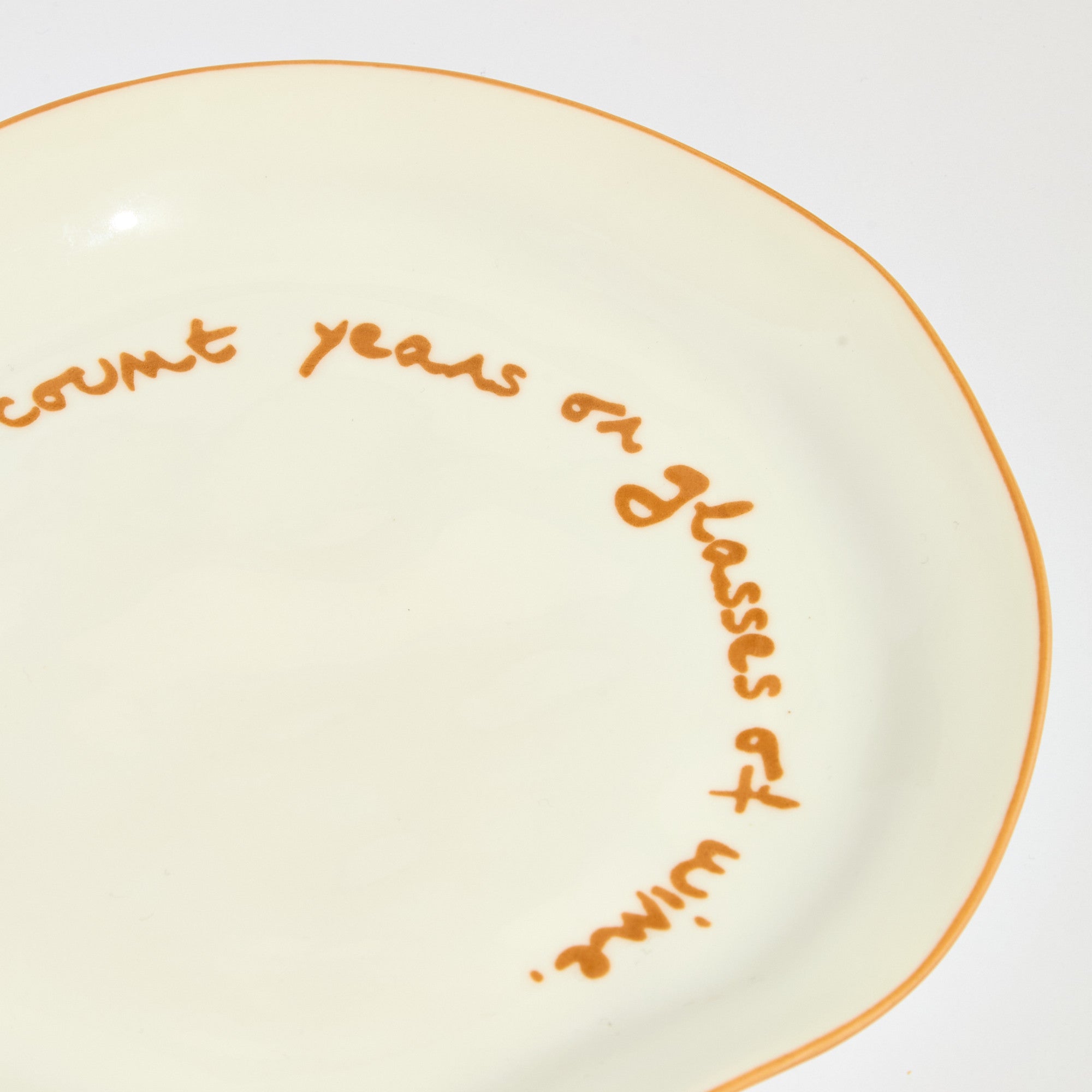 Statement plate - "Never Count Years and Glasses of Wine"