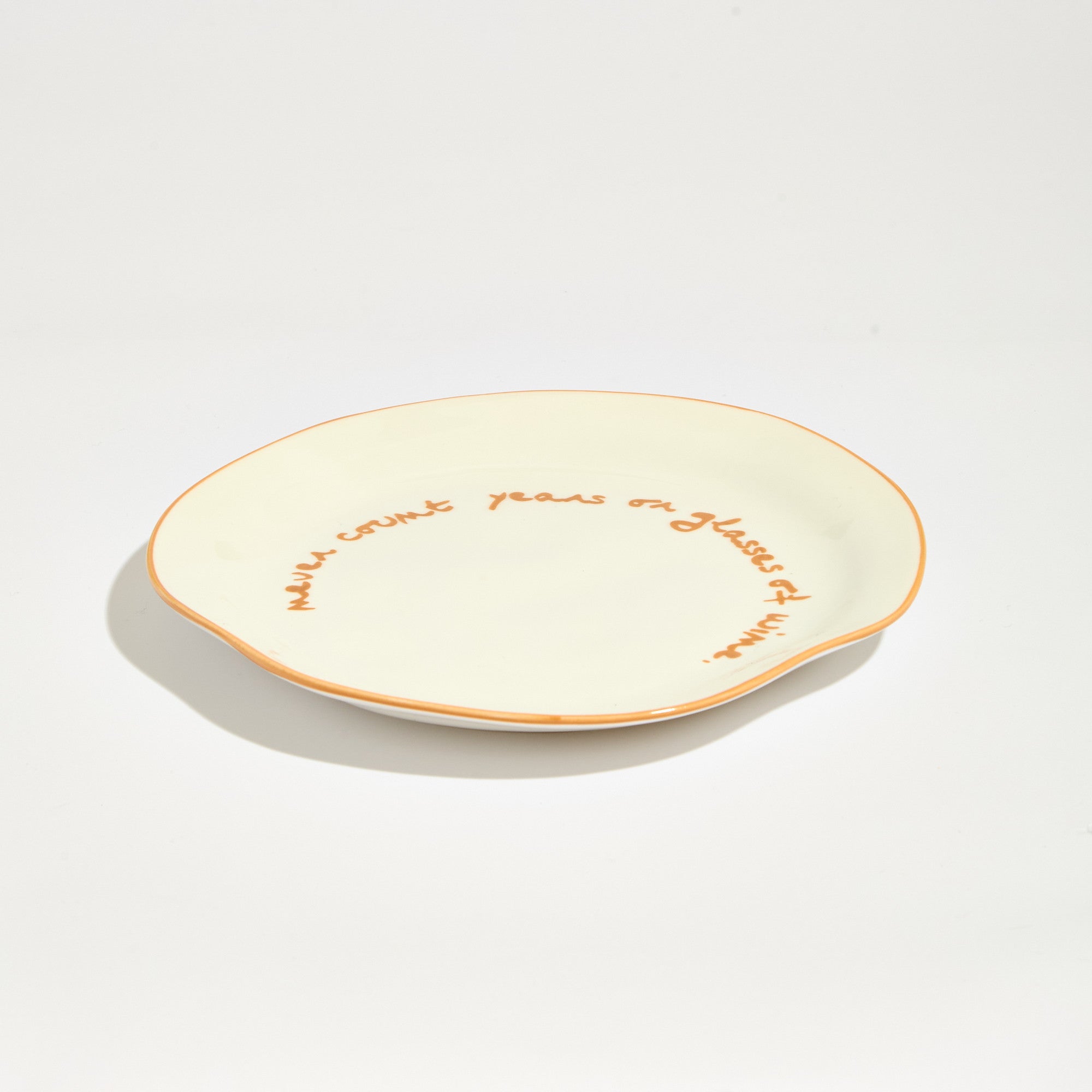 Statement plate - "Never Count Years and Glasses of Wine"