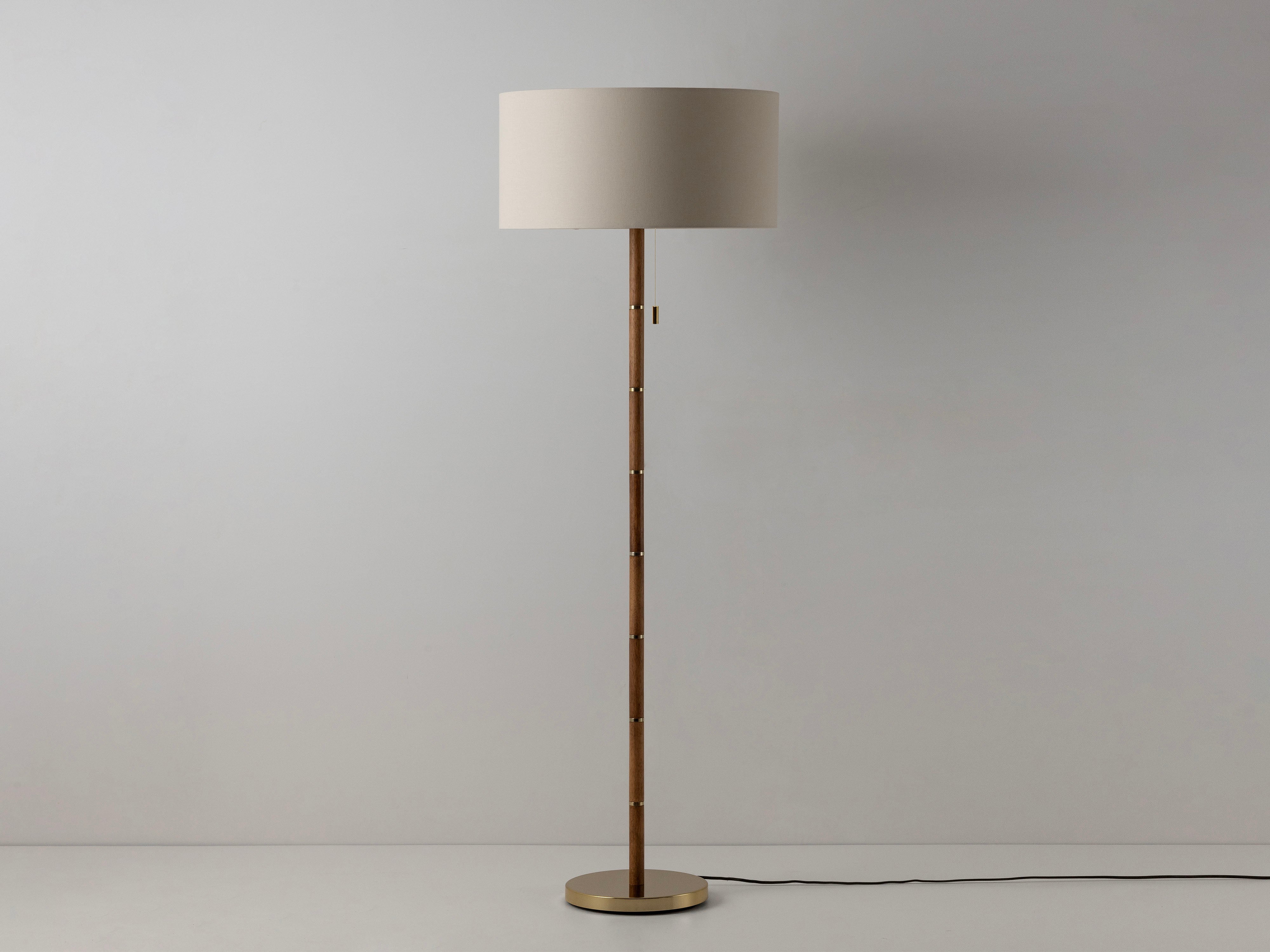 Wooden and brass disk floor lamp