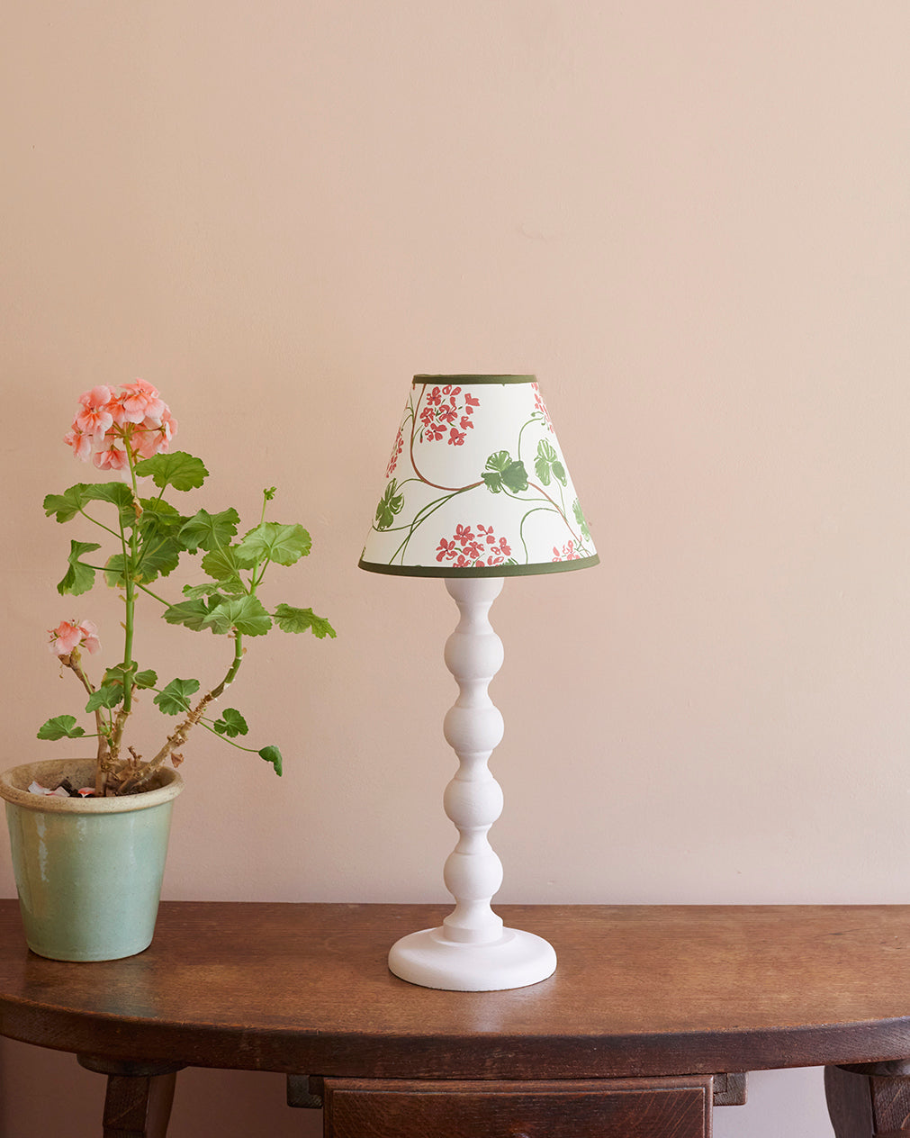 Geraniums, paper lampshade, empire